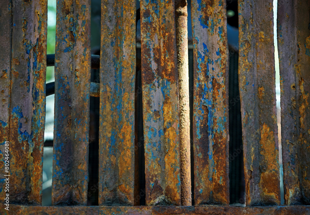 Rust on iron bar with blue and yellow color.Corrosive grunge rusted on old iron.Pattern grunged rust as illustration for presentation background.Rusty corrosion or oxidized texture.Close up. Rust on iron bar with blue and yellow color.Corrosive grunge rusted on old iron.Pattern grunged rust as illustration for presentation background.Rusty corrosion or oxidized texture.Close up.