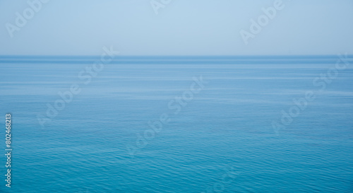 Still calm sea or ocean blue water surface background