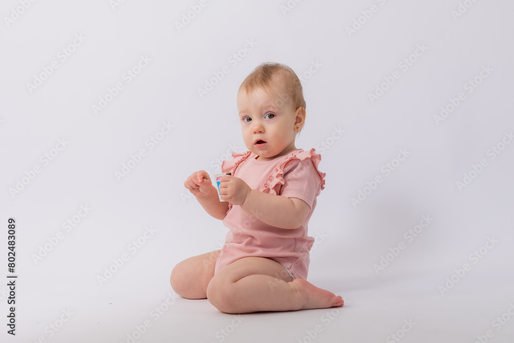 Cute baby girl in pink bodysuit on white background, space for text Cute baby girl in pink bodysuit on white background, space for text