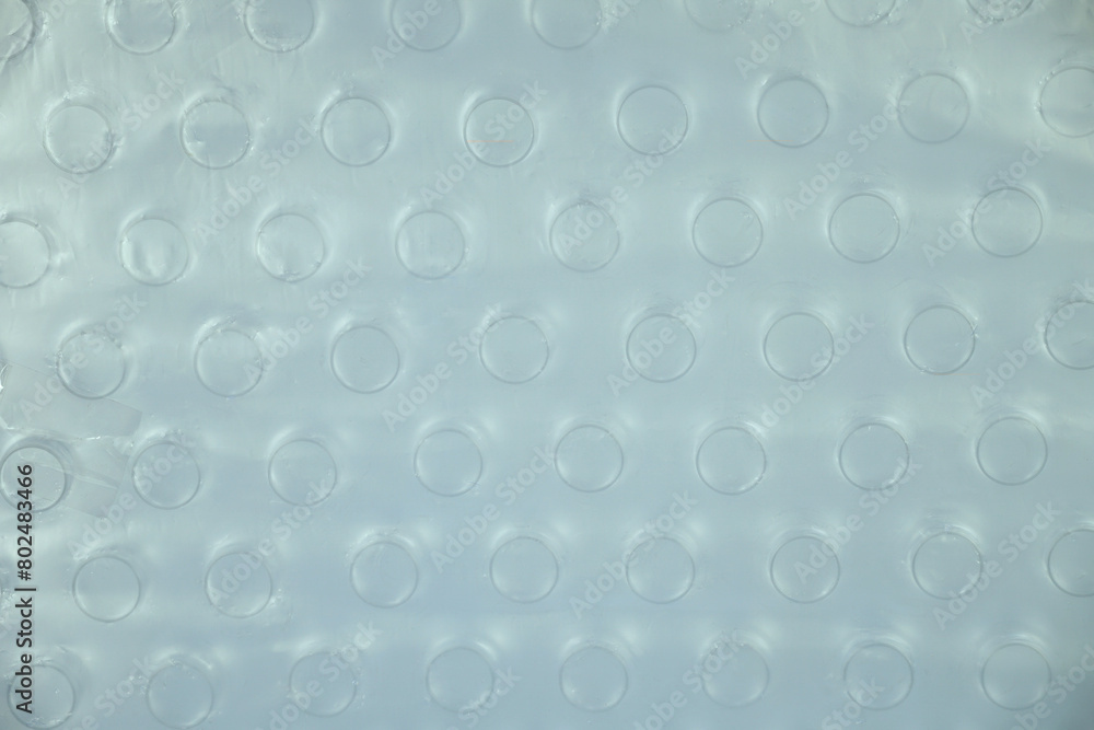 Pattern of top of a new plastic water bottle wrapped in plastic is cloudy. Pattern of top of a new plastic water bottle wrapped in plastic is cloudy.