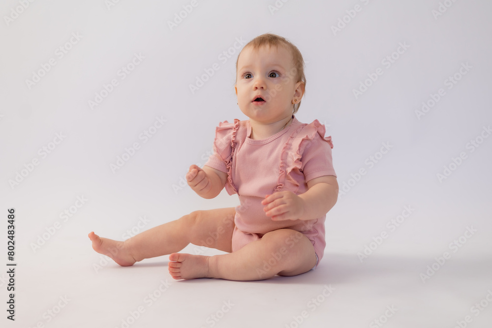 Cute baby girl in pink bodysuit on white background, space for text Cute baby girl in pink bodysuit on white background, space for text