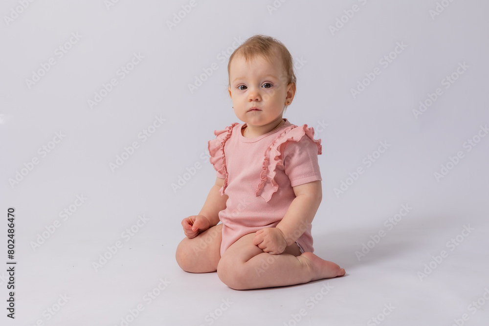Cute baby girl in pink bodysuit on white background, space for text Cute baby girl in pink bodysuit on white background, space for text