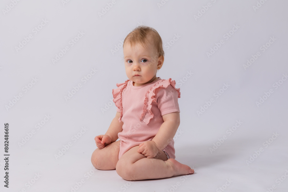 Cute baby girl in pink bodysuit on white background, space for text Cute baby girl in pink bodysuit on white background, space for text