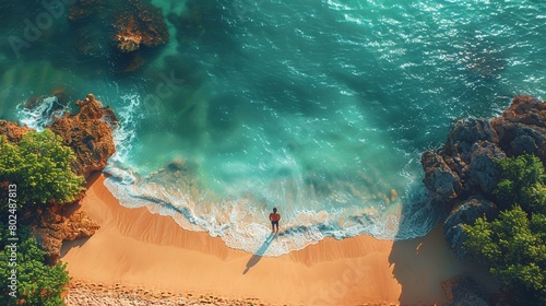 An aerial view of a paradisiacal beach on a lonely day.