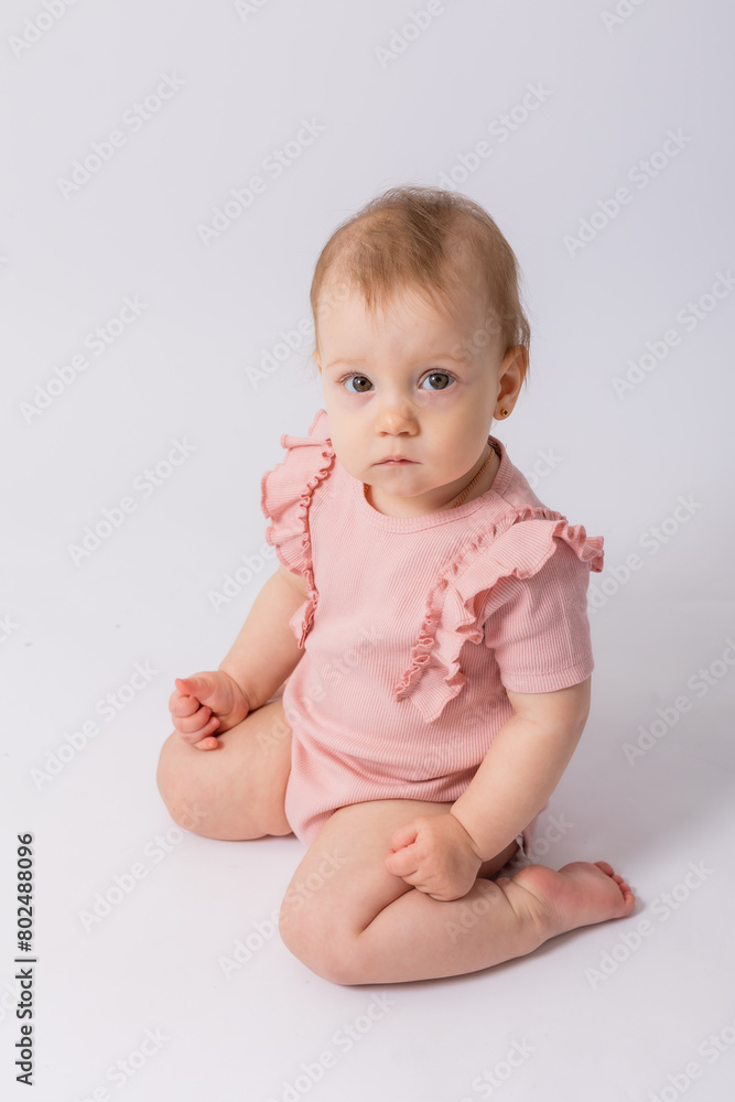Cute baby girl in pink bodysuit on white background, space for text Cute baby girl in pink bodysuit on white background, space for text