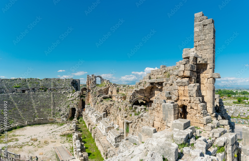 Picturesque ruins of an amphitheater in the ancient city of Perge, Turkey. Perge open-air museum.