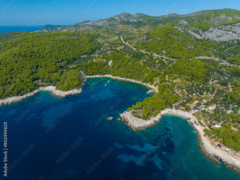 AERIAL: Flying high above the rugged coast of Hvar reveals two secluded beaches. AERIAL: Flying high above the rugged coast of Hvar reveals two secluded beaches.