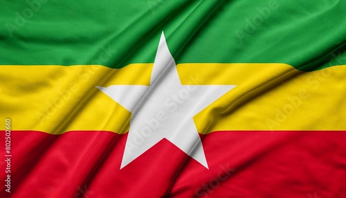 folded flag of Burma with visible satin texture