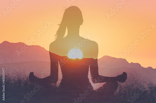 Woman in yoga pose, zen meditation at sunset. 