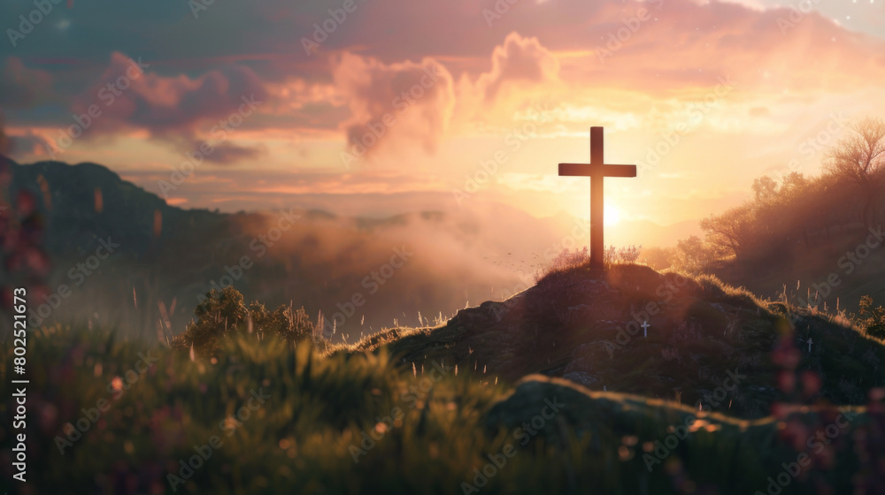 A christian cross on top of a hill during sunset