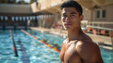Young Asian Male Swimmer Relaxing by Outdoor Pool with Sunlight Reflection