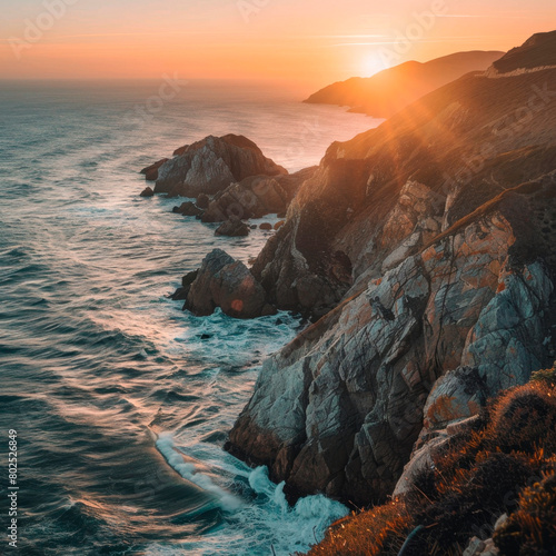 Panoramic sunset view of a rugged, rocky coastline, sea, ocean view.