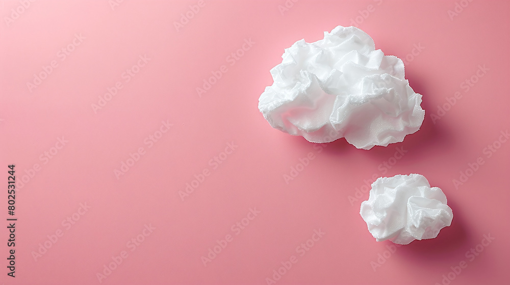 White Crumpled Paper Balls on Soft Pink Background Creative Concept