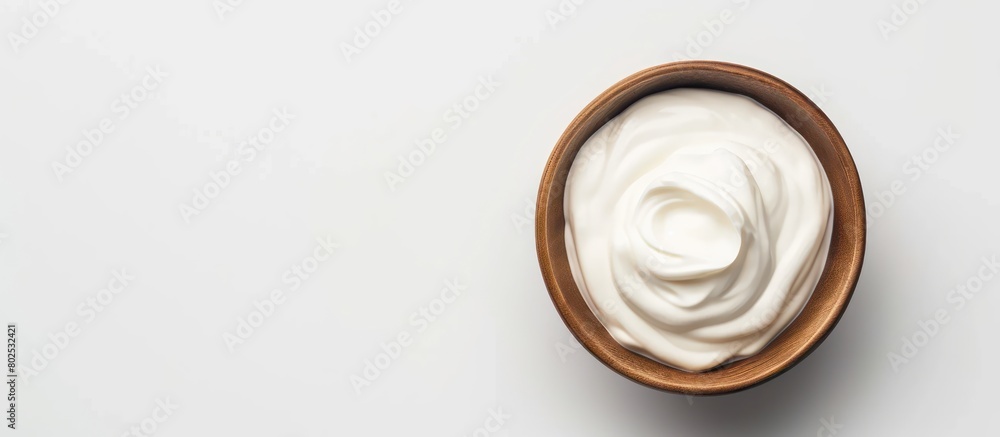 A bowl of Greek-styled sour cream on a white background A bowl of Greek-styled sour cream on a white background