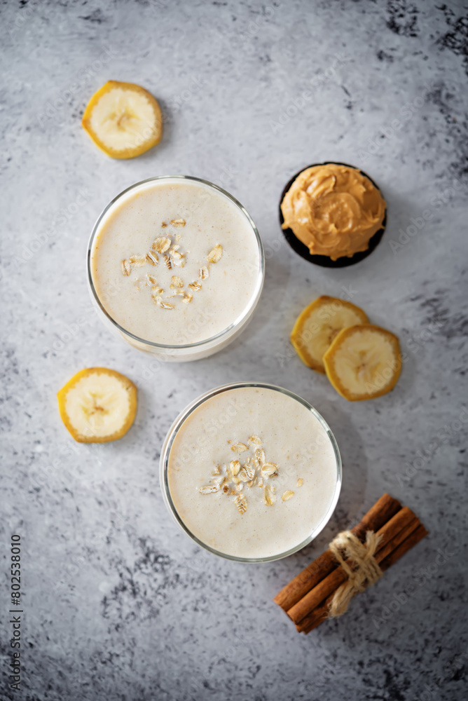 Peanut butter banana smoothie in a glass Peanut butter banana smoothie in a glass