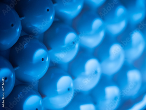 Abstract background of blue plastic bubbles.