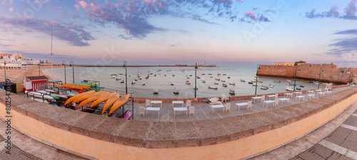 Panoramic view of the city beach and the bay of Cadiz at dawn.