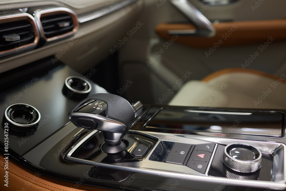 a close up of a car dashboard with a remote control