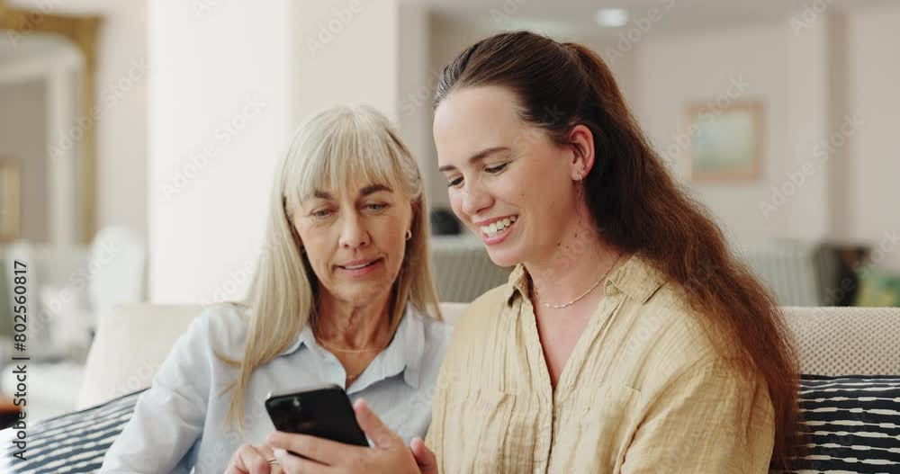 Family, senior mom and daughter with smartphone on sofa with smile for teaching, learning and support for care. Living room, couch and happy with browsing internet for fun and games at old age home Family, senior mom and daughter with smartphone on sofa with smile for teaching, learning and support for care. Living room, couch and happy with browsing internet for fun and games at old age home