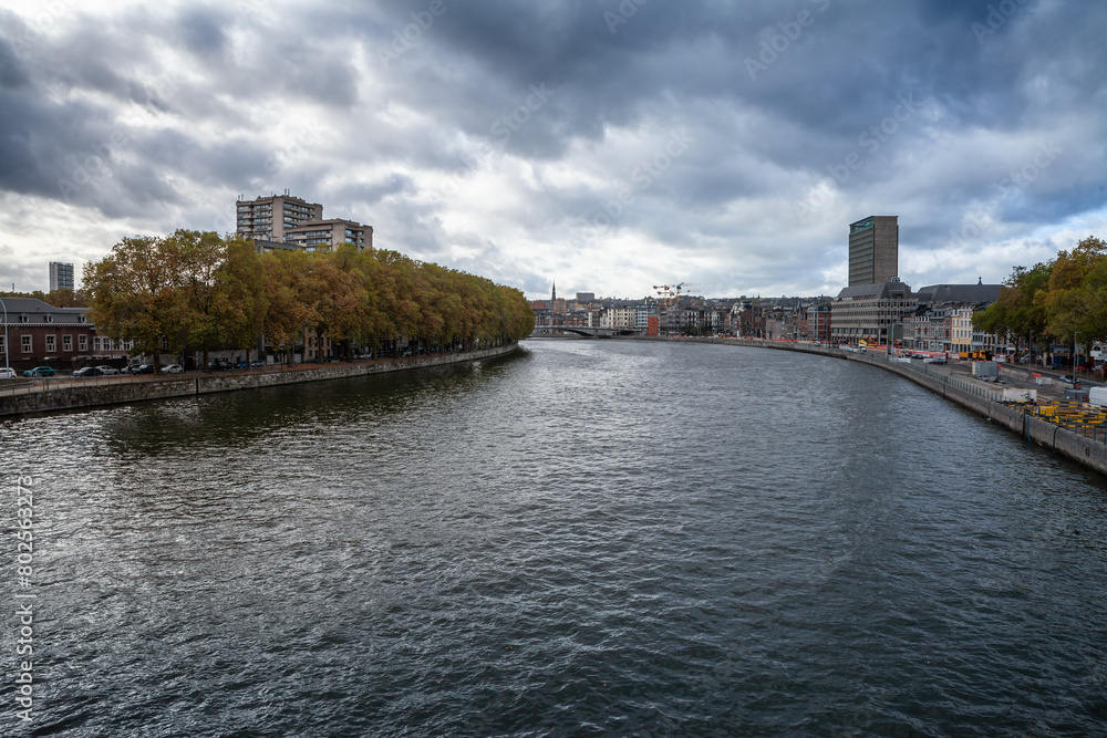 Panorama of the city center of Liege, Belgium, during a cloudy afternoon of autumn, in centre ville, with the meuse river (maas) in front. Liege is one of the biggest cities of Belgium and Wallonia. Panorama of the city center of Liege, Belgium, during a cloudy afternoon of autumn, in centre ville, with the meuse river (maas) in front. Liege is one of the biggest cities of Belgium and Wallonia.