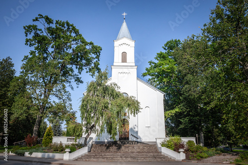 Panorama of the peterupe evangelical lutheran church in Saulkrasti, latvia. Also called peterupes evangeliski luteriska draudze, it's a protestant church, white color, from the latvian church. photo