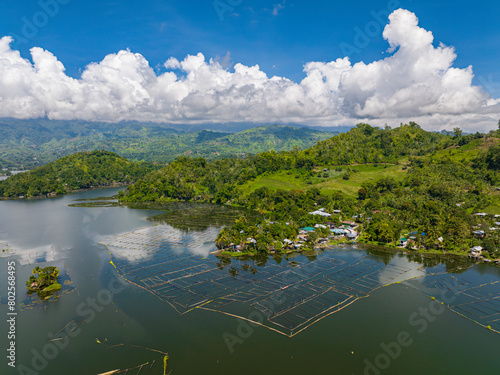 Mountain with rainforest sorrounded in Lake Sebu. Blue sky and clouds. Mindanao, Philippines.