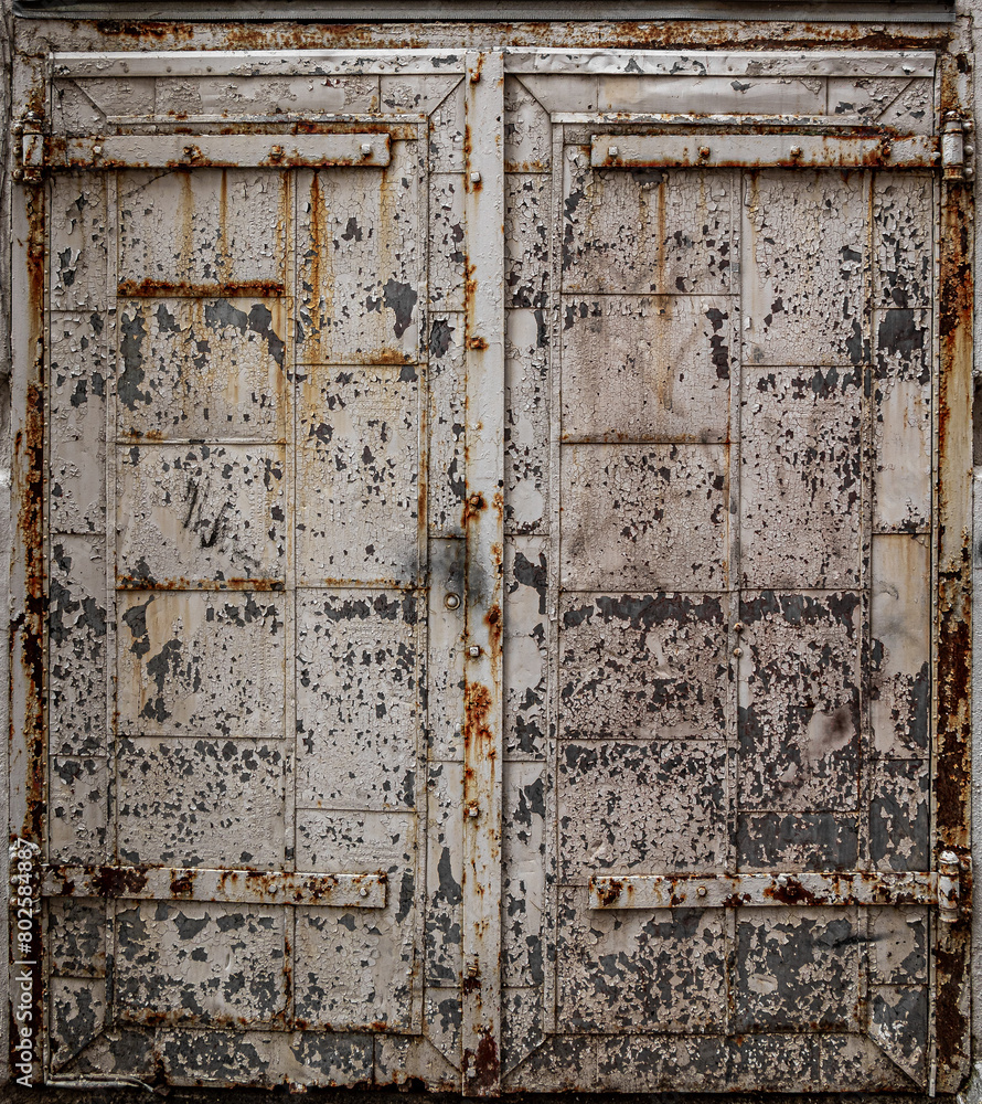 Naklejka premium Background image from an old rusting door paint peeling off has a grunge look