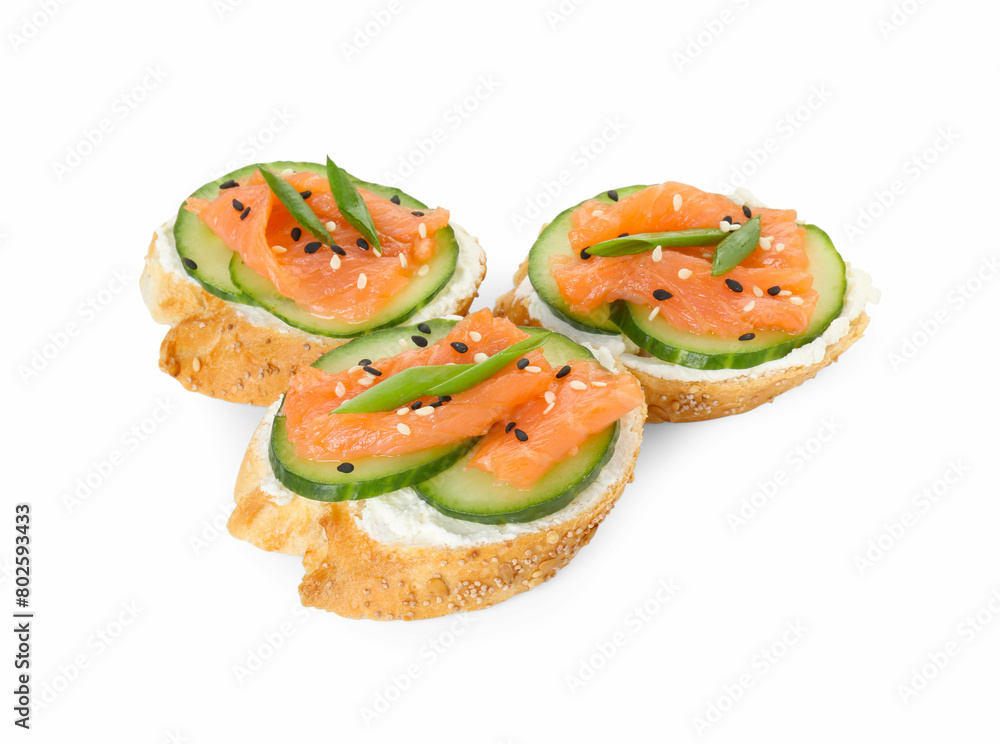 Tasty canapes with salmon, cucumber and cream cheese isolated on white