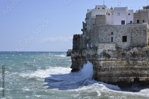 abitazioni del centro storico di polignano a mare in puglia a picco sul mare durante una giornata ventosa photo