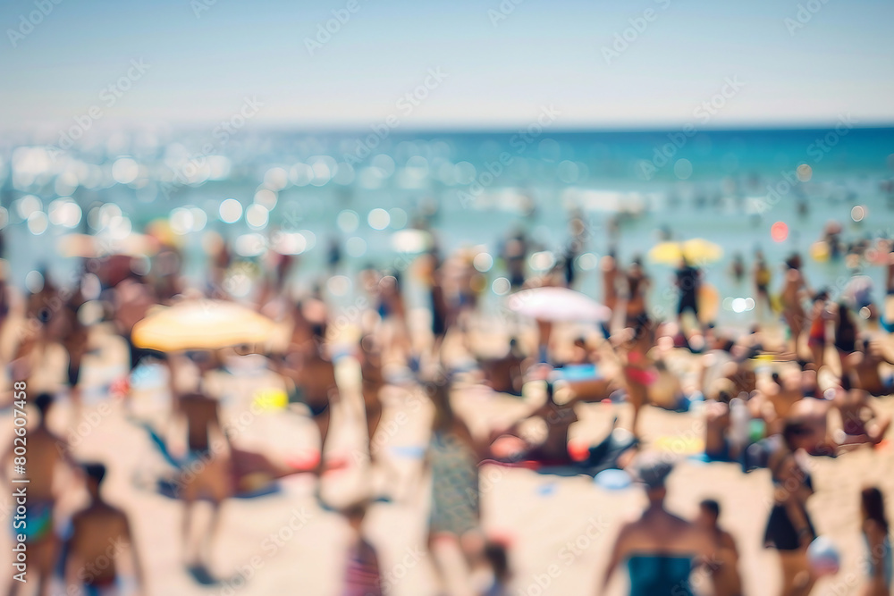 blurred photograph of crowded Beach.