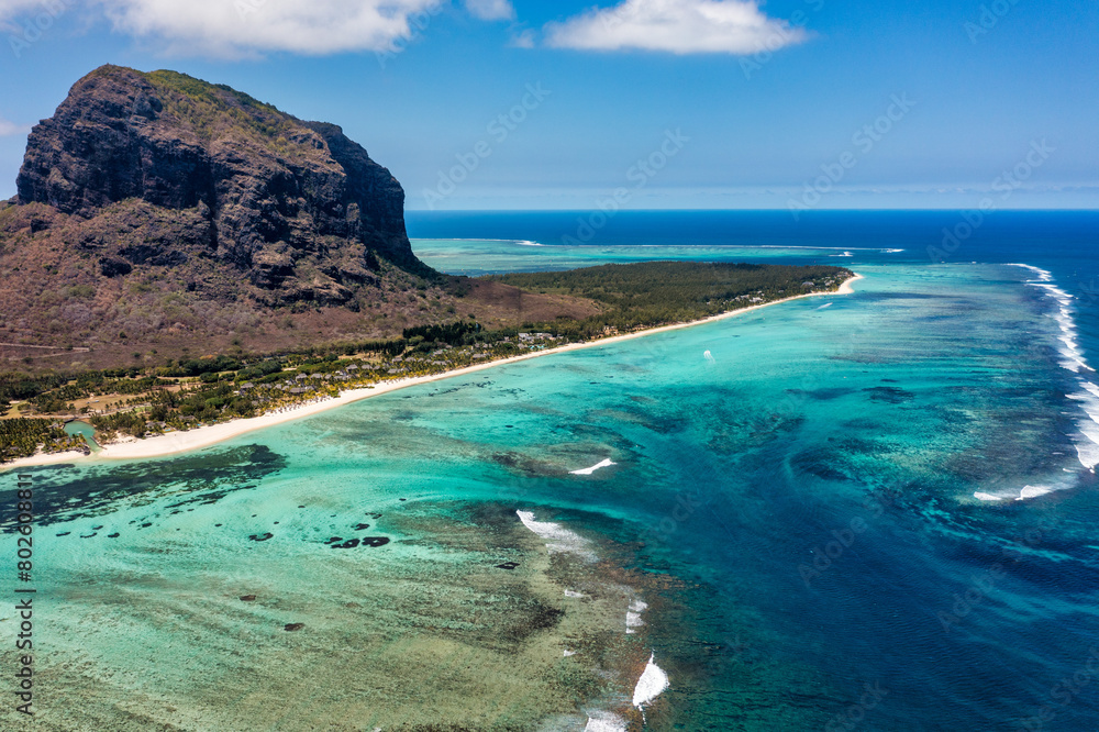 Aerial view of Mauritius island panorama and famous Le Morne Brabant mountain, beautiful blue lagoon and underwater waterfall. Aerial view of Le morne Brabant in Mauriutius. Aerial view of Mauritius island panorama and famous Le Morne Brabant mountain, beautiful blue lagoon and underwater waterfall. Aerial view of Le morne Brabant in Mauriutius.