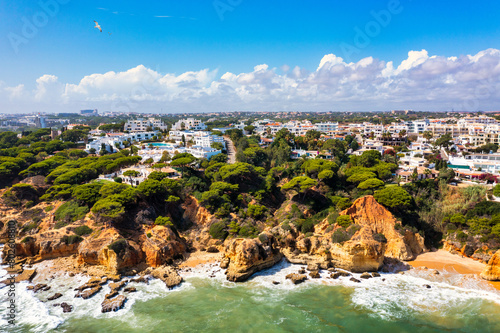 Amazing view from the sky of town Olhos de Agua in Albufeira, Algarve, Portugal. Aerial coastal view of town Olhos de Agua, Albufeira area, Algarve, Portugal.