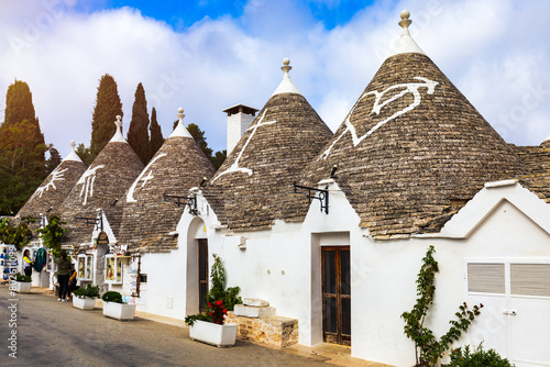 The traditional Trulli houses in Alberobello city, Apulia, Italy. Cityscape over the traditional roofs of the Trulli, original and old houses of this region, Apulia, Alberobello, Puglia, Italy.