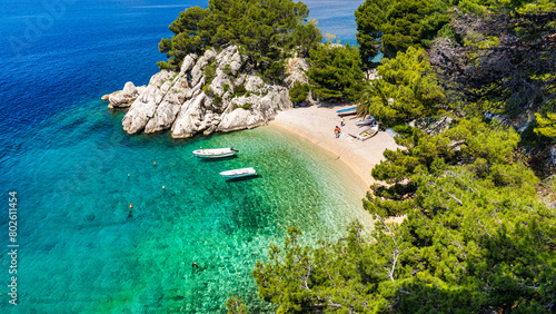 Amazing aerial view of the beautiful Podrace beach in Brela, Makarska Riviera, Croatia. Aerial view of Podrace beach and waterfront on Makarska riviera, Brela, Dalmatia region of Croatia. photo