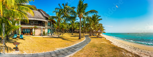 Le morne Brabant beach in Mauriutius. Tropical crystal ocean with Le Morne beach and luxury beach in Mauritius. Le Morne beach with palm trees, white sand and luxury resorts, Mauritius. photo