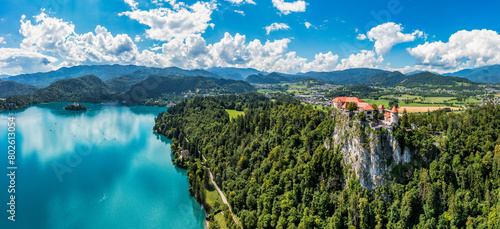 Bled, Slovenia, aerial view of beautiful Bled Castle (Blejski Grad) with Lake Bled (Blejsko Jezero), the Church of the Assumption of Maria on a bright summer day. Bled, Slovenia. photo