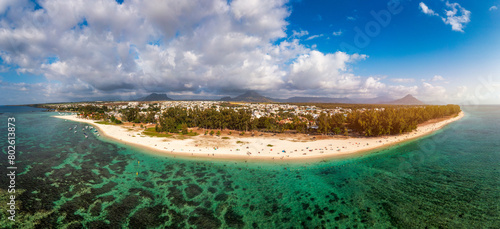 Beautiful Mauritius Island with gorgeous beach Flic en Flac, aerial view from drone. Mauritius, Black River, Flic-en-Flac view of oceanside village beach and luxurious hotel in summer.