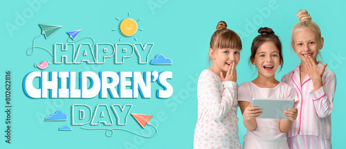 Cute little girls with tabl...
