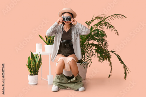 Female traveler with photo ...
