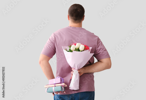Handsome young man with gif...