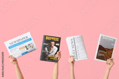 Female hands with newspaper...
