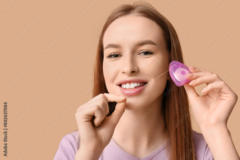 Young woman with dental floss on beige background, closeup Young woman with dental floss on beige background, closeup