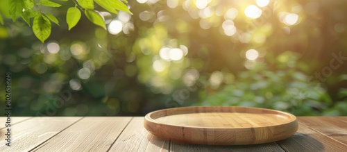 Background of food, Wooden plate with nothing on it, container for showcasing kitchen items on a table against a backdrop of blurred green trees in a garden with bokeh lights in the background,