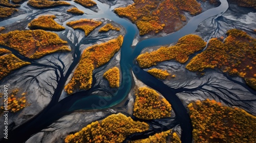 Aerial view of autumn landscape with winding river and colorful foliage