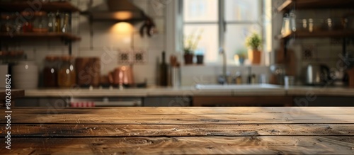 Kitchen interior background with a blurred effect featuring a wooden table in the foreground.