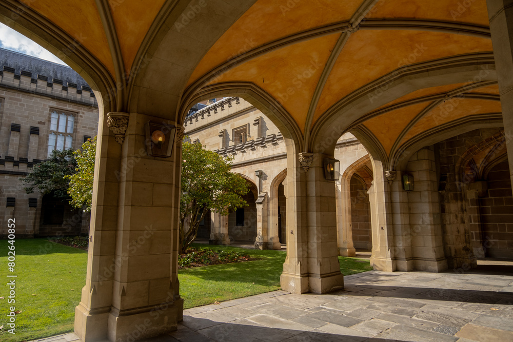 Historic walkway under the arches at The Old Quadrangle, which is the oldest building on campus. The iconic landmark at University of Melbourne, VIC Australia.