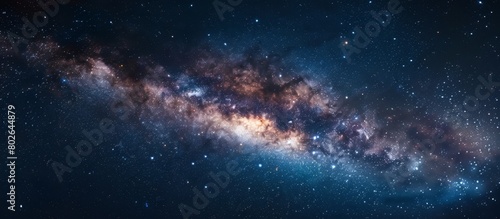 Capturing a detailed view of a vast galaxy, filled with numerous sparkling stars, set against a deep and dark night sky
