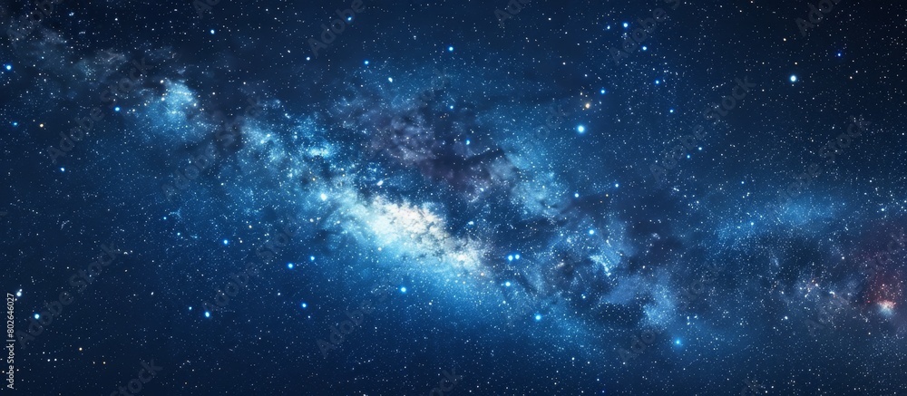 Glowing stars form the Milky Way in a dark night sky, creating a mesmerizing celestial view Glowing stars form the Milky Way in a dark night sky, creating a mesmerizing celestial view