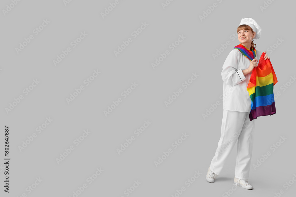 Female chef with LGBT flag on light background Female chef with LGBT flag on light background