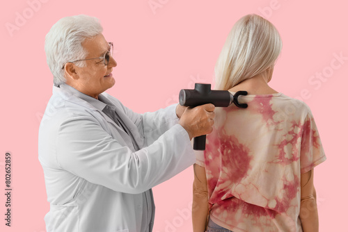 Male physiotherapist massag...